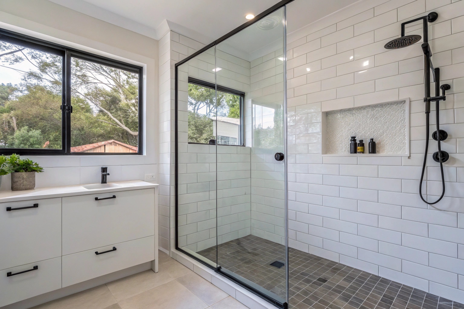 a-clean--modern-walk-in-shower-with-large-format-w Modern walk-in shower with large format tiles and frameless glass in Lake Macquarie bathroom renovation